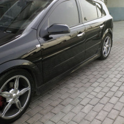 Бічні спідниці HB (під фарбування) для Opel Astra H 2004-2013рр